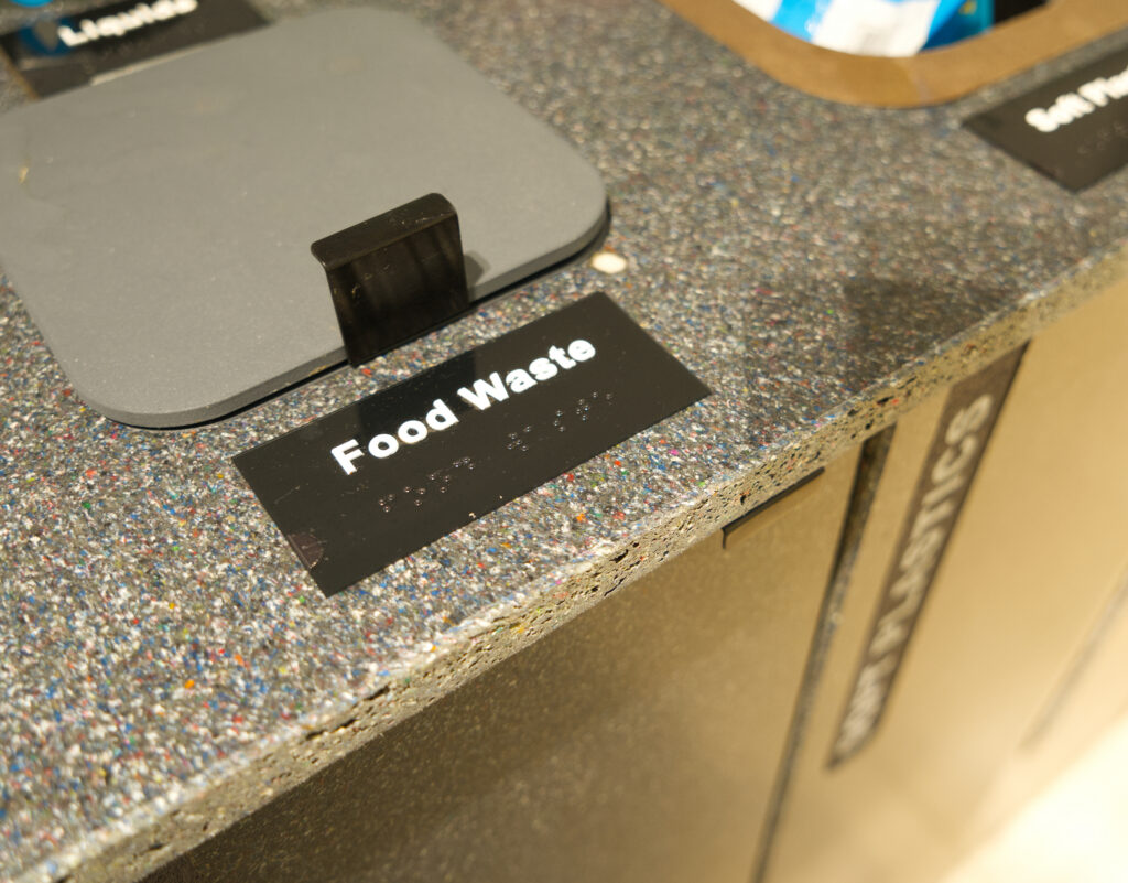 Close up of the recycled material worktop and the braille food waste label