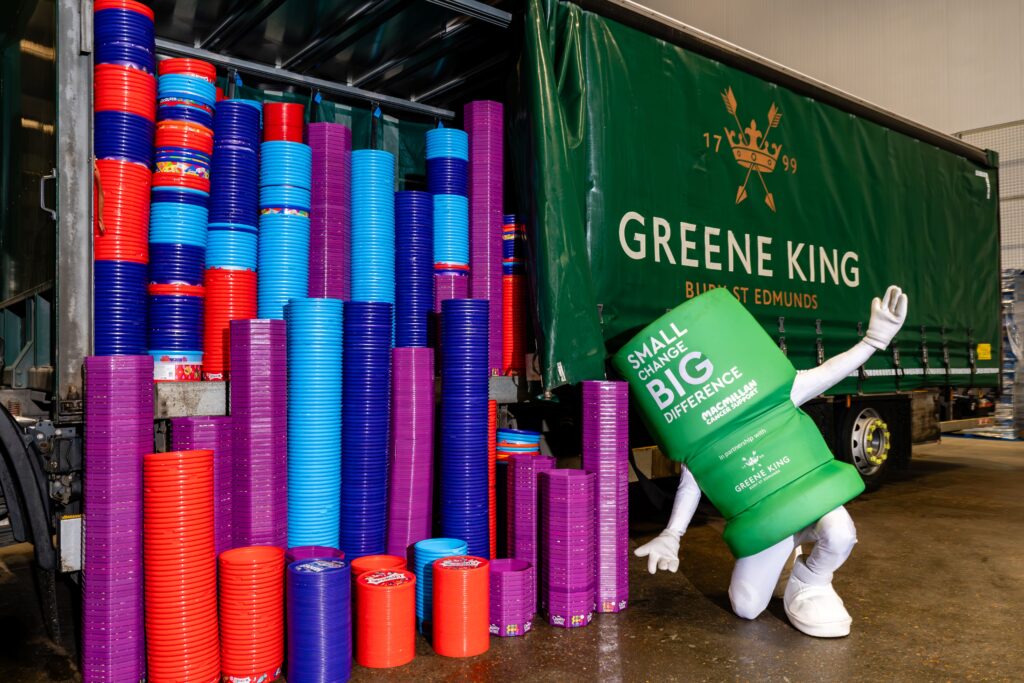 Stacks of collected sweet and cracker tubs being loaded onto a Greene King lorry